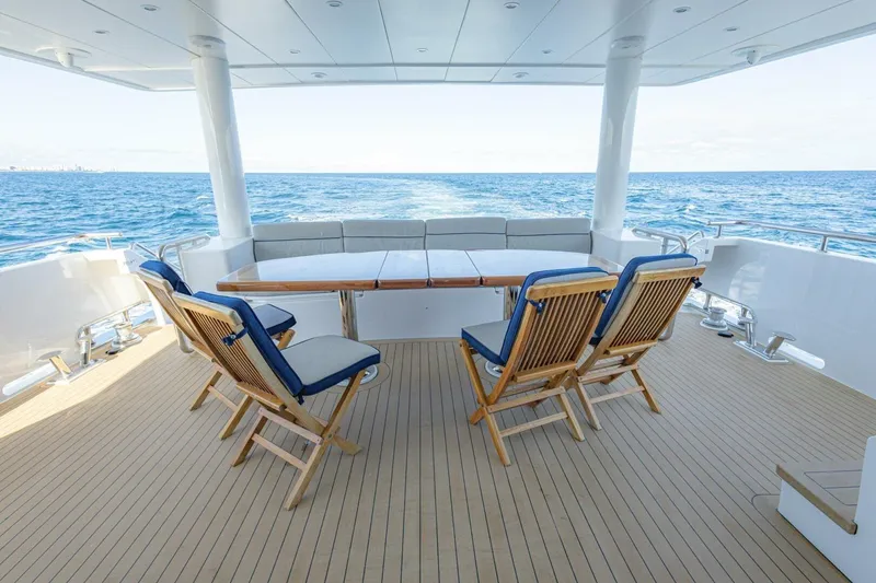 Slide: The Image of 2009 Hargrave Enclosed Bridge yacht deck with grill, ocean view, and city skyline. - 55