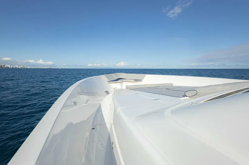 Slide: The Image of Bow view of 2009 Hargrave Enclosed Bridge yacht on open sea with city skyline. - 69