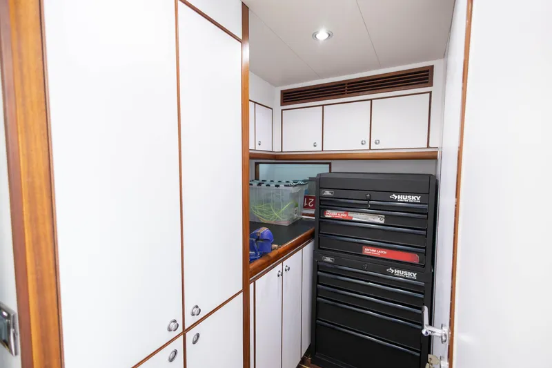 Slide: The Image of 2009 Hargrave Enclosed Bridge yacht cruising on open sea under clear blue sky. - 77