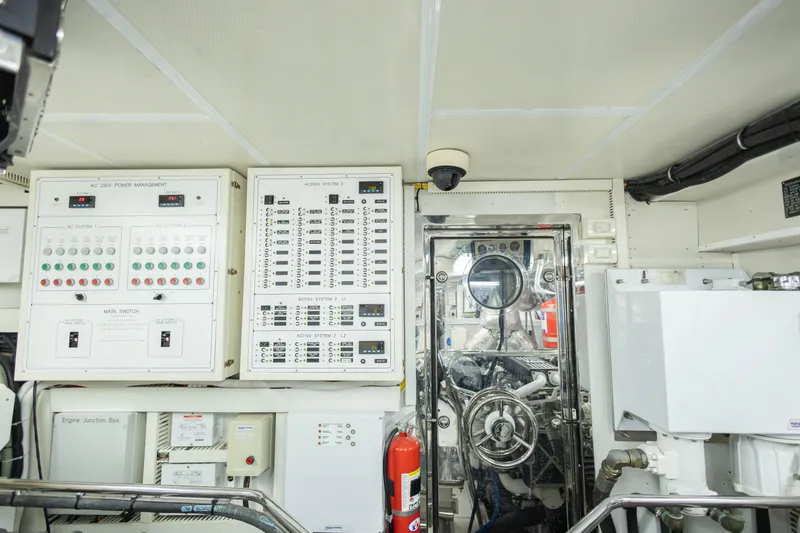 Slide: The Image of 2009 Hargrave Enclosed Bridge yacht interior with tool storage and white cabinetry. - 82