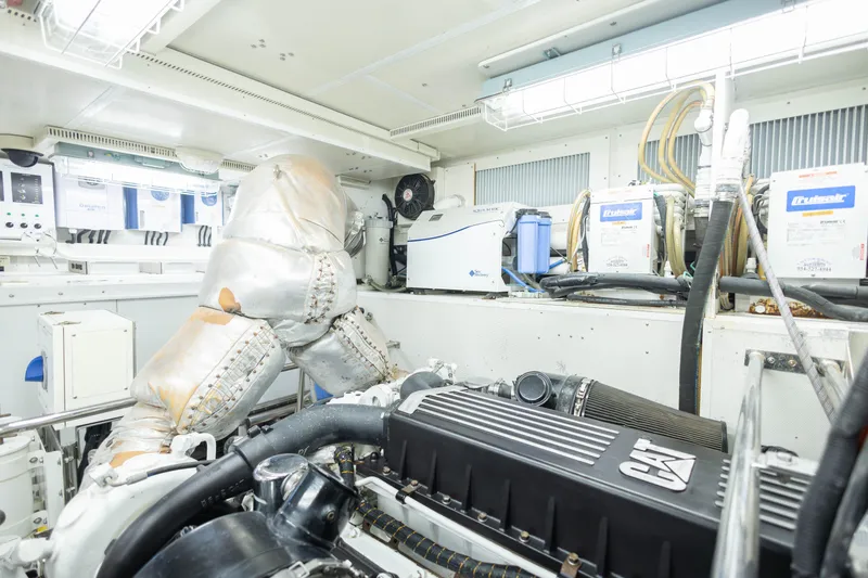 Slide: The Image of Engine room of 2009 Hargrave Enclosed Bridge yacht, featuring modern equipment and controls. - 83