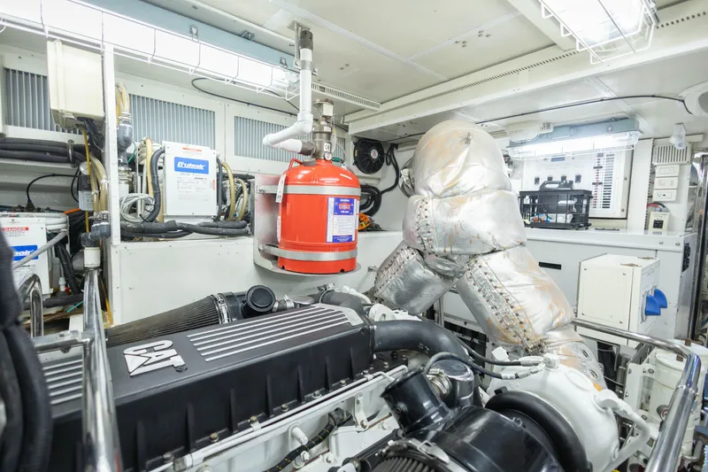 Slide: The Image of Engine room of 2009 Hargrave Enclosed Bridge yacht, featuring machinery and control panels. - 84