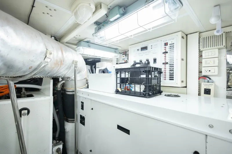 Slide: The Image of Engine room of 2009 Hargrave Enclosed Bridge yacht with control panels and equipment. - 90