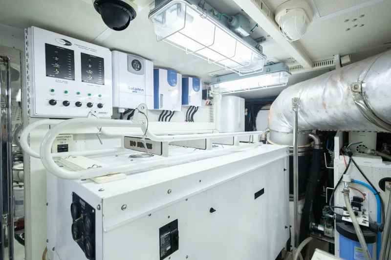 Slide: The Image of Engine room of 2009 Hargrave Enclosed Bridge yacht with control panels and machinery. - 91