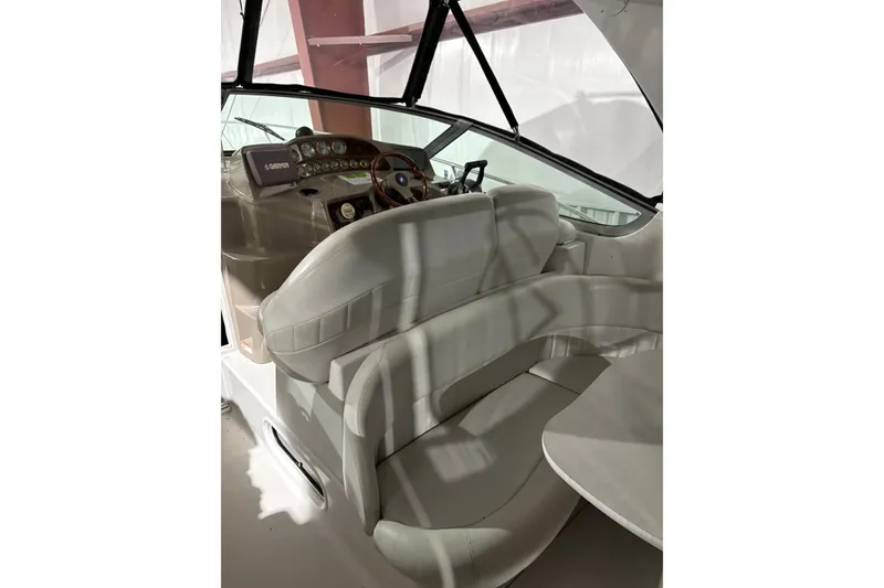 The Image of 2003 Four Winns 328 Vista boat interior with helm and seating area. - 0