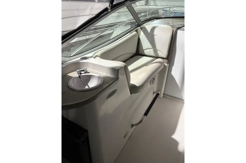 Slide: The Image of 2003 Four Winns 328 Vista boat interior with sink and seating area. - 10