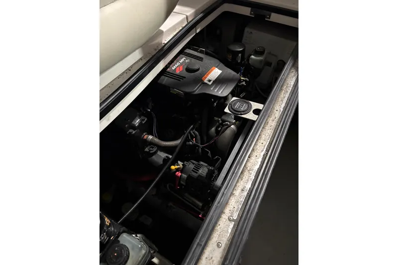 Slide: The Image of Engine compartment of a 2003 Four Winns 328 Vista boat, showcasing mechanical components. - 21