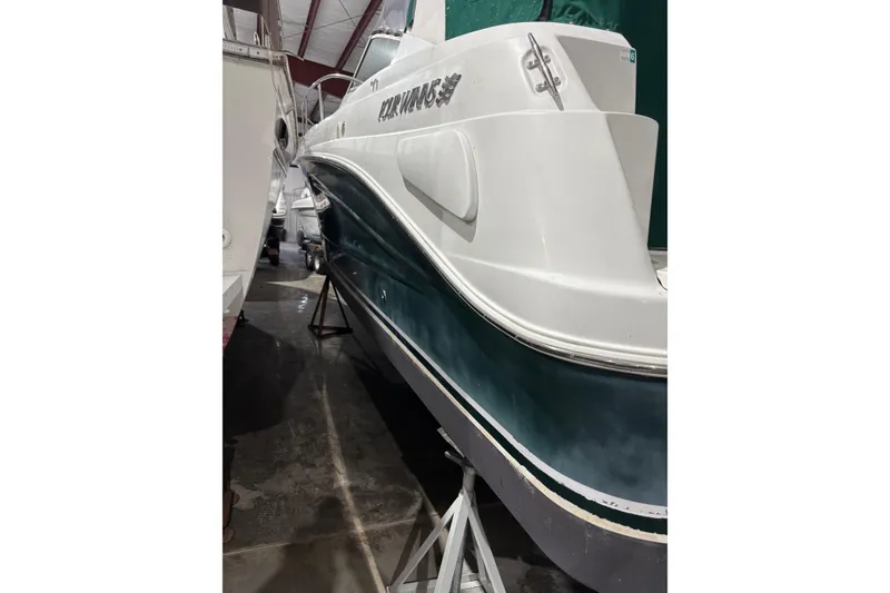 Slide: The Image of 2003 Four Winns 328 Vista boat in storage, side view. - 3