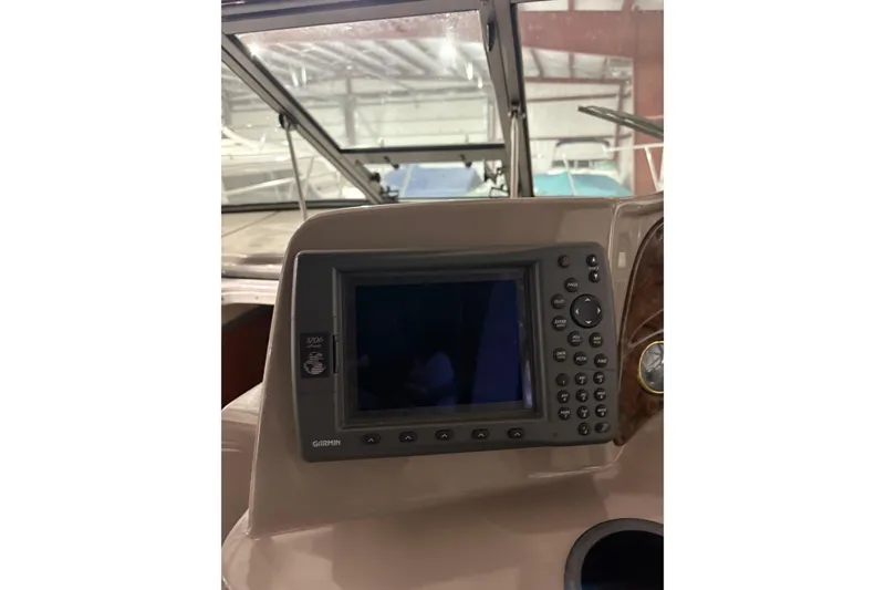 Slide: The Image of 2003 Four Winns 328 Vista boat dashboard with Garmin navigation system. - 7