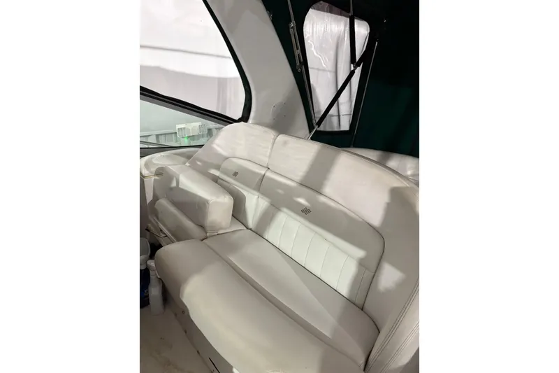 Slide: The Image of 2003 Four Winns 328 Vista boat interior with white leather seating. - 9
