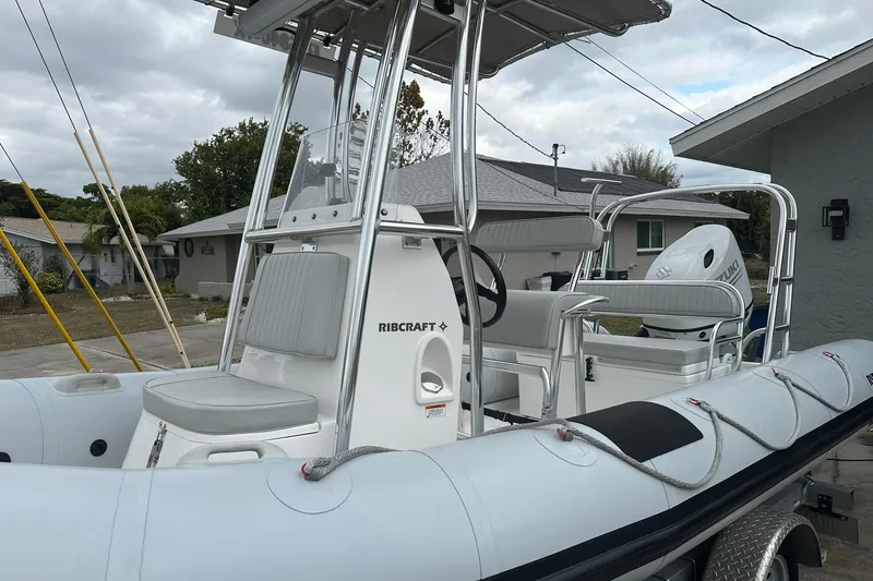 The Image of 2023 Ribcraft 5.85 boat with seating and steering console, parked outdoors. - 0