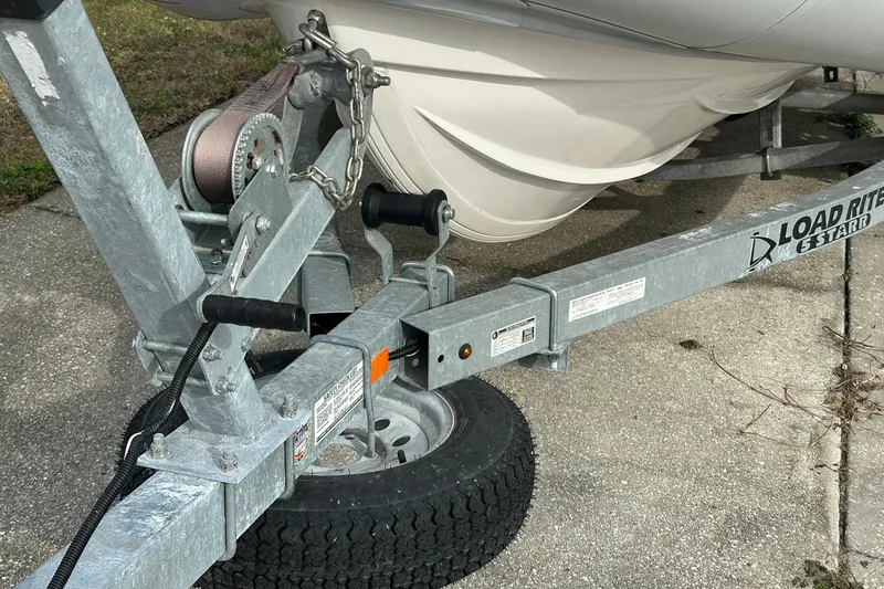 Slide: The Image of Trailer hitch with Ribcraft 5.85 boat, 2023 model, on Load Rite trailer. - 17