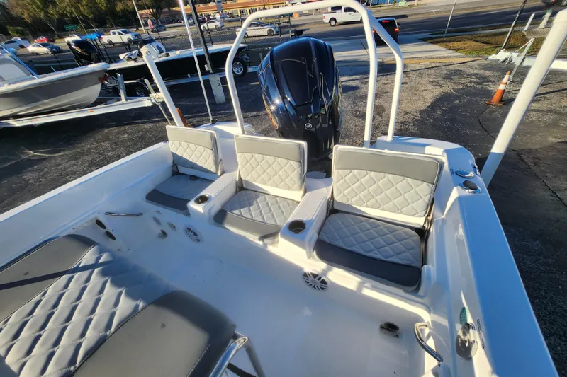 Slide: The Image of 2026 NauticStar 231 Hybrid boat interior with cushioned seating and modern design. - 3