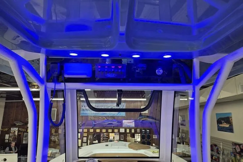 Slide: The Image of Interior view of 2026 Sea Hunt Ultra 275 Coffin Box with blue LED lighting. - 14