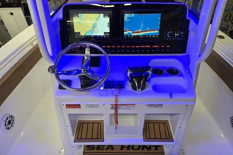 Slide: The Image of 2026 Sea Hunt Ultra 275 Coffin Box boat dashboard with navigation screens and controls. - 18