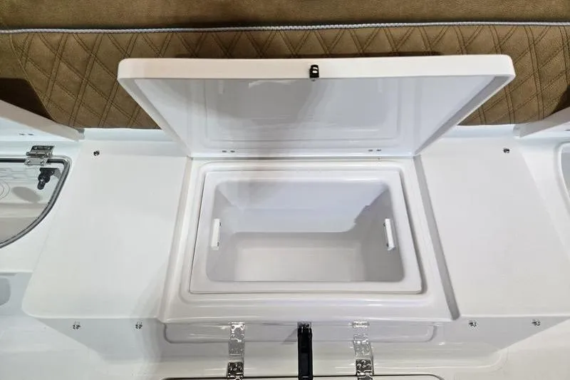 Slide: The Image of 2026 Sea Hunt Ultra 275 Coffin Box with open storage compartment. - 21