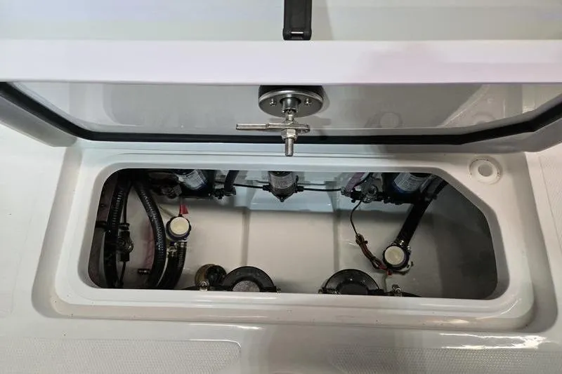 Slide: The Image of 2026 Sea Hunt Ultra 275 Coffin Box interior with visible components and wiring. - 28