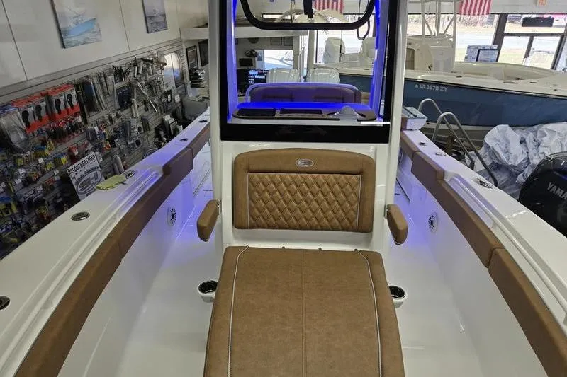 Slide: The Image of Interior view of 2026 Sea Hunt Ultra 275 Coffin Box boat with tan seating. - 9