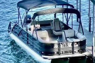 The Image of 2025 Bentley Pontoons Legacy 243 Swingback on water, featuring sleek design and comfortable seating. - 1