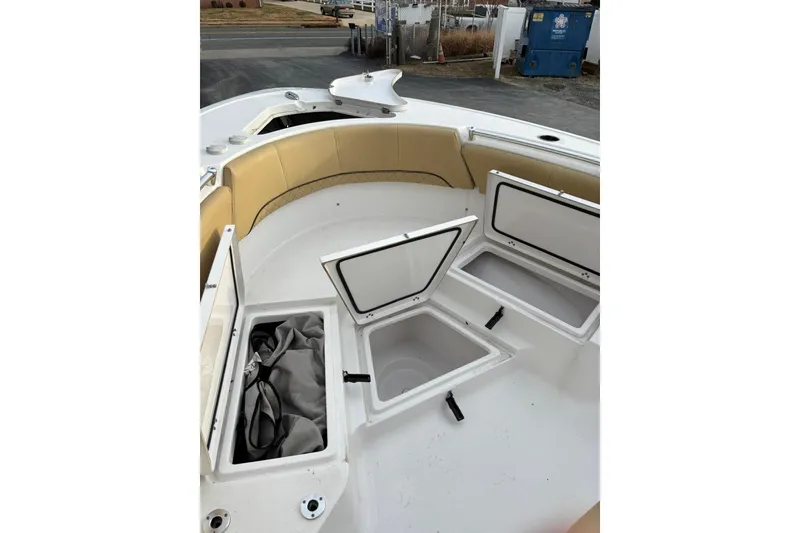 Slide: The Image of 2021 Sportsman Heritage 231 Center Console boat with open storage compartments. - 21