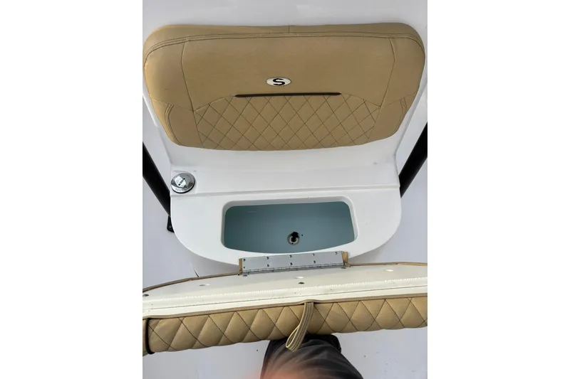 Slide: The Image of 2021 Sportsman Heritage 231 Center Console boat seat and storage compartment. - 22