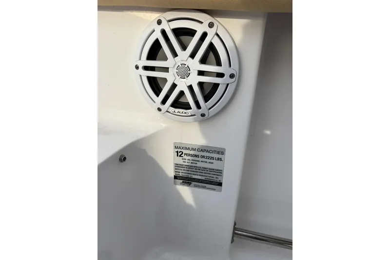 Slide: The Image of Speaker and capacity label on 2021 Sportsman Heritage 231 Center Console boat. - 26