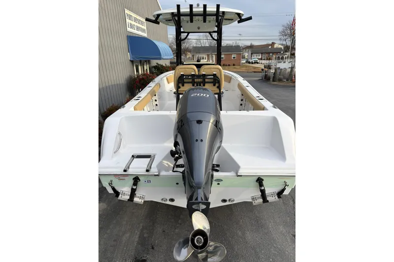 Slide: The Image of 2021 Sportsman Heritage 231 Center Console boat with powerful outboard motor. - 5