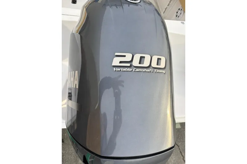 Slide: The Image of Yamaha 200 outboard motor with variable camshaft timing on Sportsman Heritage 231 Center Console. - 6