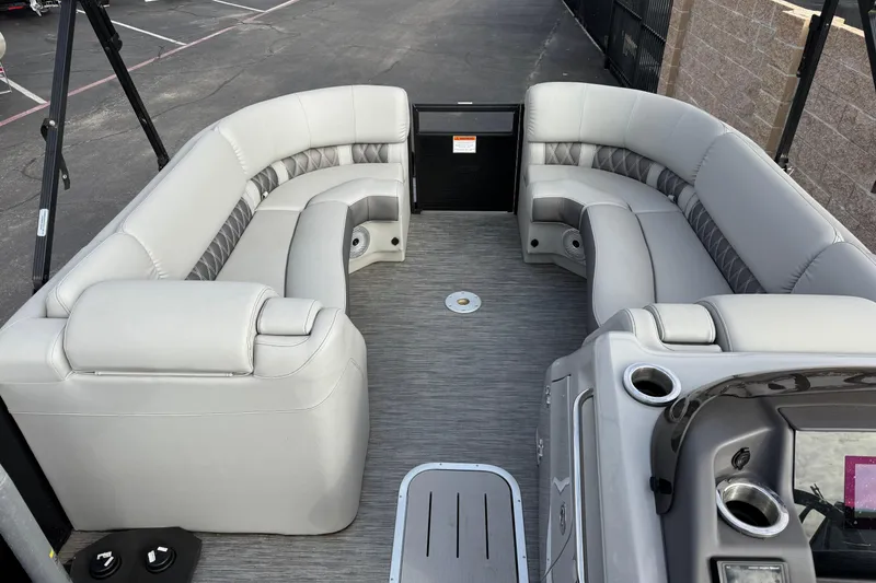 Slide: The Image of 2022 Bennington R23 boat interior with luxurious gray seating and modern design. - 6