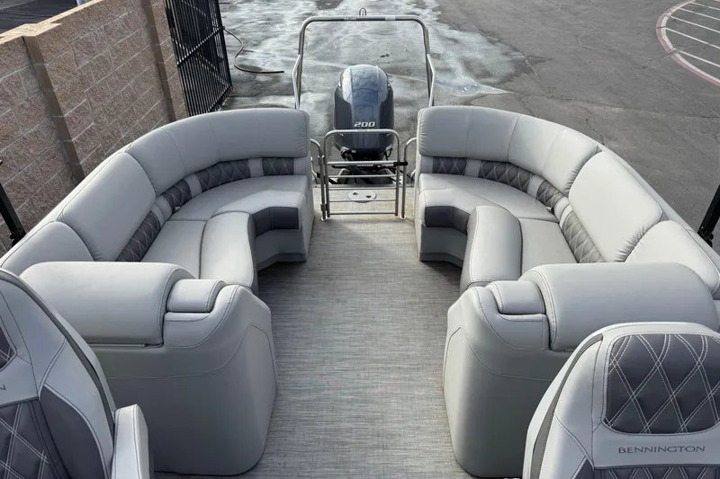 Slide: The Image of 2022 Bennington R23 pontoon boat with luxurious seating and powerful engine. - 8