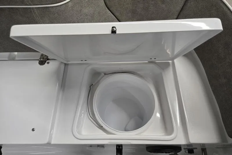 Slide: The Image of Open storage compartment on 2025 Sea Hunt Ultra 229 boat, showcasing interior design. - 21
