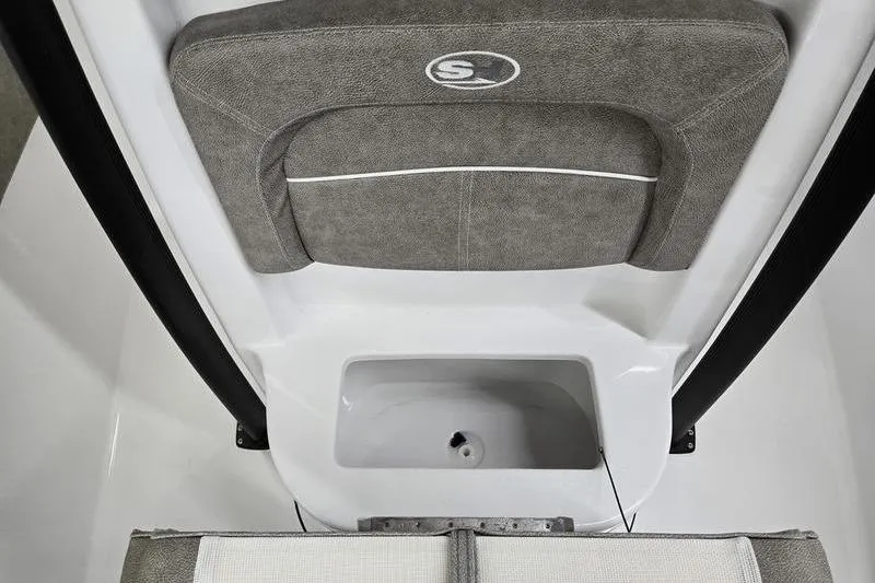 Slide: The Image of 2025 Sea Hunt Ultra 229 boat interior with cushioned seating and storage compartment. - 5