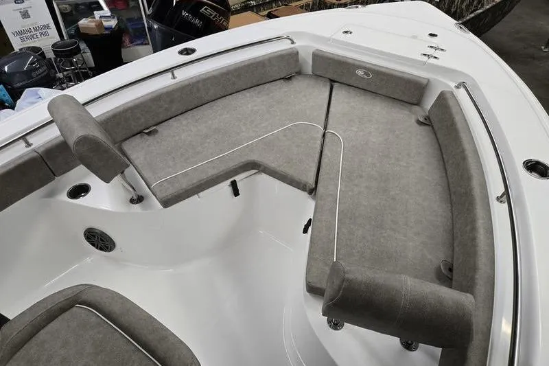 Slide: The Image of 2025 Sea Hunt Ultra 229 boat interior with gray cushioned seating. - 6