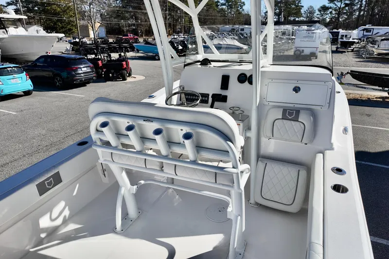 Slide: The Image of 2026 Sea Fox 248 Side Console boat interior with seating and rod holders. - 14