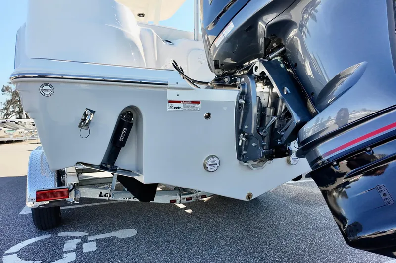 Slide: The Image of 2026 Sea Fox 248 Side Console boat engine and trailer detail. - 16