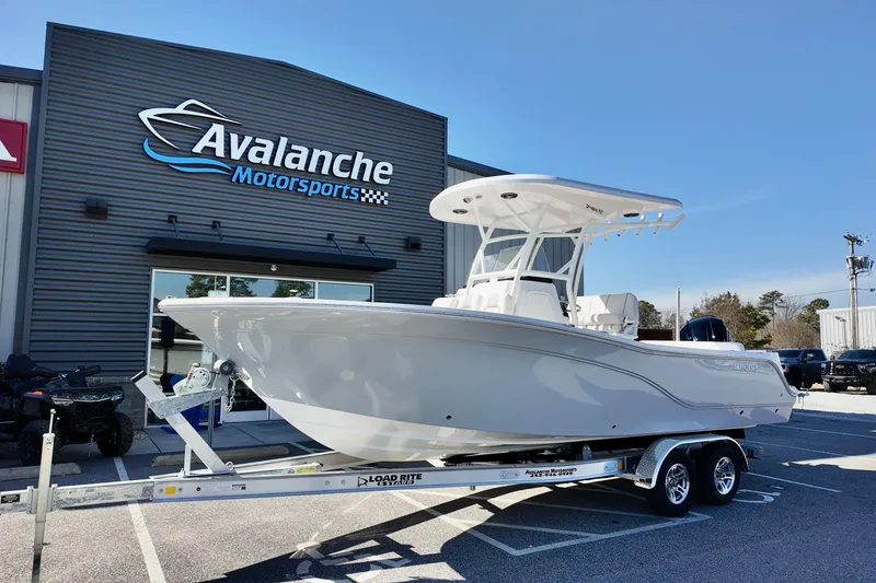 The Image of 2026 Sea Fox 248 Side Console boat on trailer at Avalanche Motorsports dealership. - 2