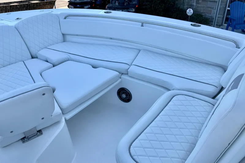 Slide: The Image of 2026 Sea Fox 248 Side Console boat with luxurious white seating and quilted upholstery. - 21