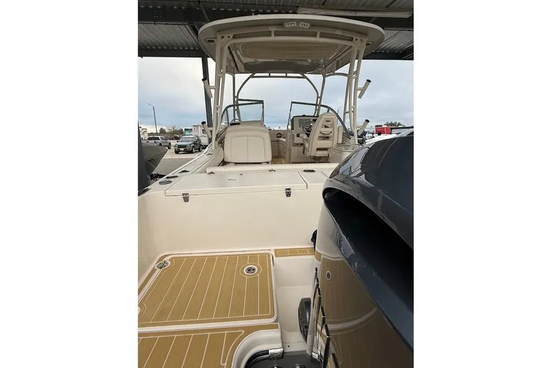 Slide: The Image of 2022 Grady-White Freedom 235 boat, rear view, under covered storage. - 11