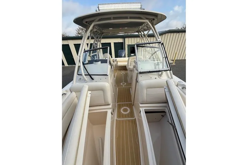 Slide: The Image of 2022 Grady-White Freedom 235 boat interior with seating and storage compartments. - 15