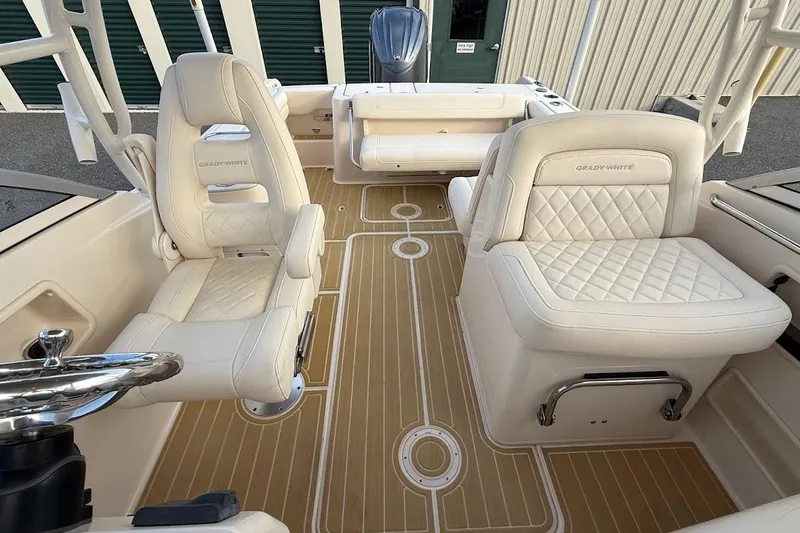 Slide: The Image of 2022 Grady-White Freedom 235 boat interior with luxurious seating and elegant flooring. - 24