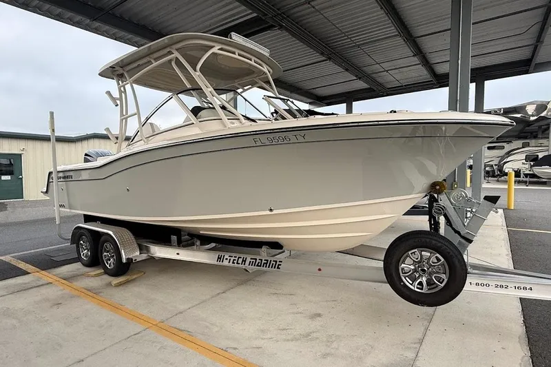 Slide: The Image of 2022 Grady-White Freedom 235 boat on trailer in covered storage area. - 3