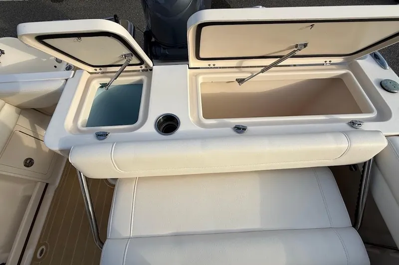 Slide: The Image of 2022 Grady-White Freedom 235 boat with open storage compartments. - 36