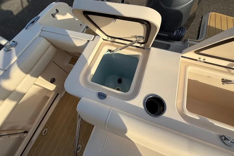 Slide: The Image of 2022 Grady-White Freedom 235 boat interior with open storage compartments. - 37