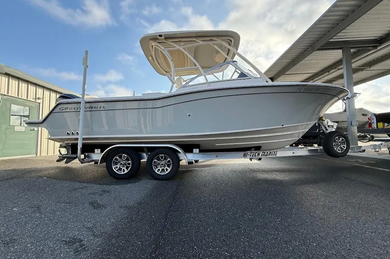 Slide: The Image of 2022 Grady-White Freedom 235 boat on trailer under shelter, side view. - 4