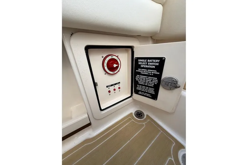 Slide: The Image of 2022 Grady-White Freedom 235 boat battery switch panel with operation instructions. - 44