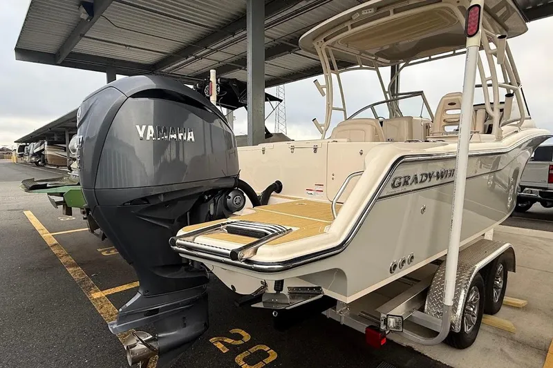 Slide: The Image of 2022 Grady-White Freedom 235 boat with Yamaha engine on trailer in parking area. - 49