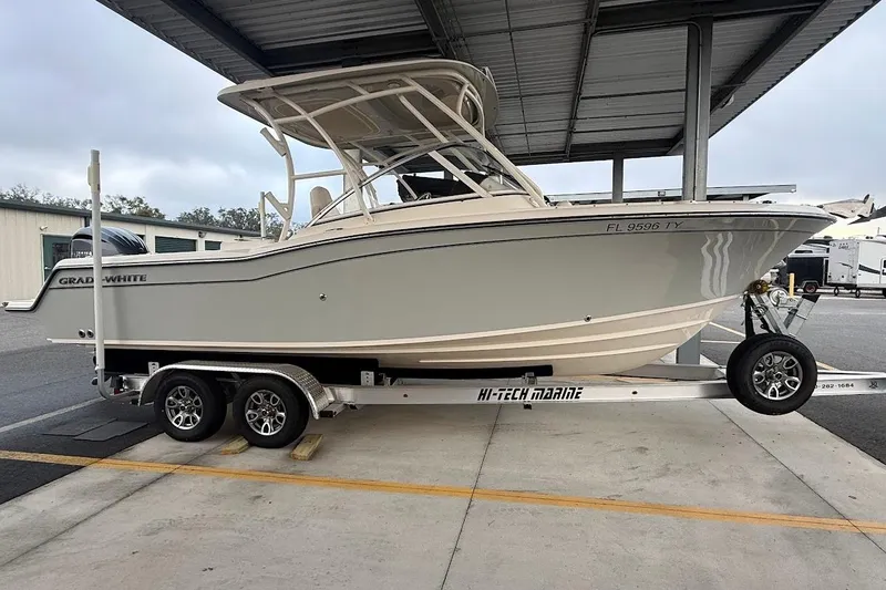 Slide: The Image of 2022 Grady-White Freedom 235 boat on trailer under shelter. - 5