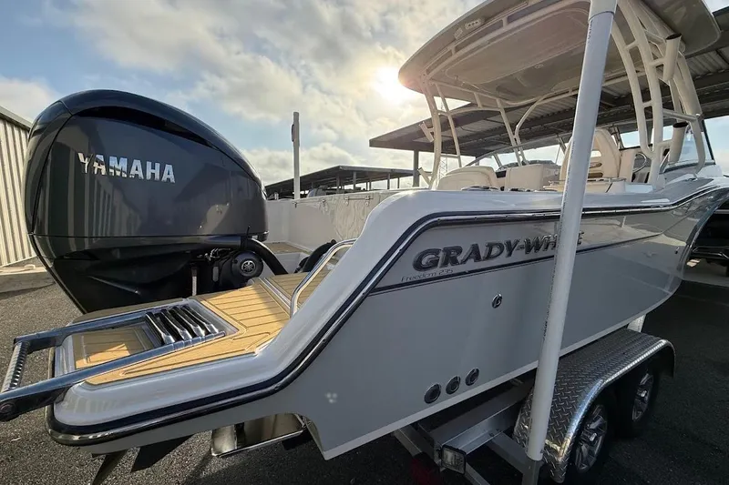 Slide: The Image of 2022 Grady-White Freedom 235 boat with Yamaha engine, parked on a trailer. - 51