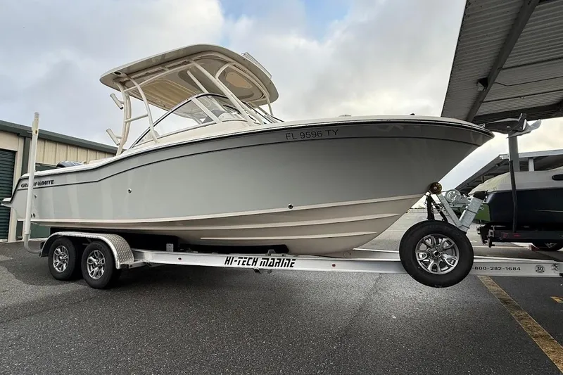 Slide: The Image of 2022 Grady-White Freedom 235 boat on trailer, parked outdoors. - 8