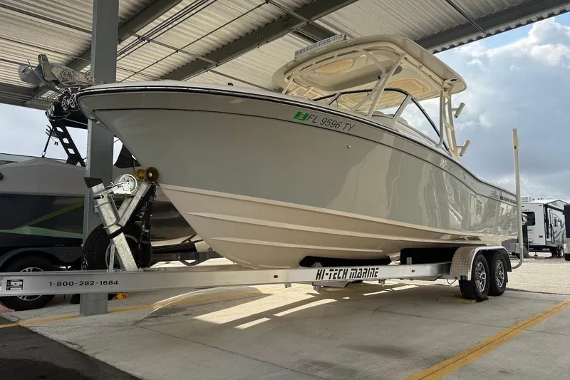 Slide: The Image of 2022 Grady-White Freedom 235 boat on trailer under shelter. - 9